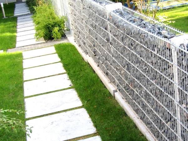 A line of welded gabion walls are installed in the garden.