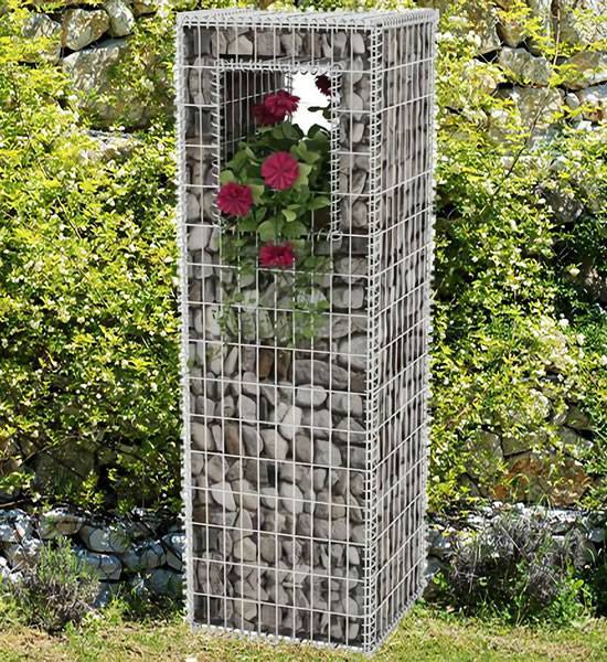 Several red flowers are raised in the space top of the gabion pillar.