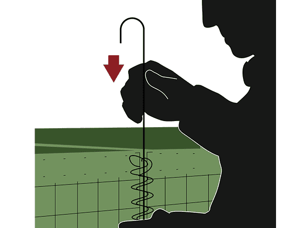 A worker is placing the joining pins into overlapped coils.