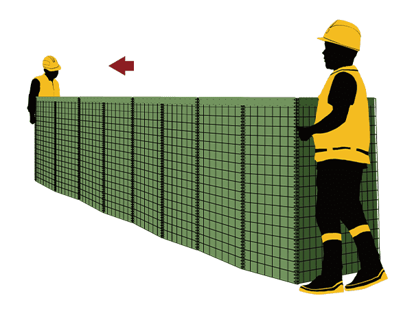 Two workers are pulling out one unit of defensive barrier.