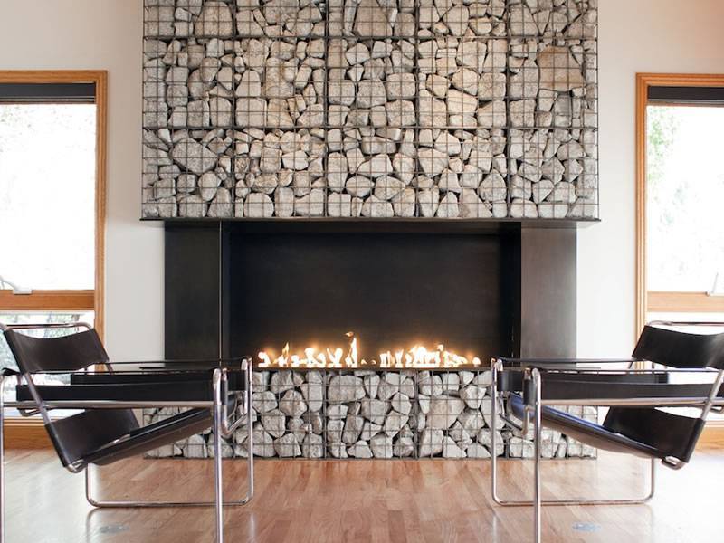 A gabion wall is installed in the living room.