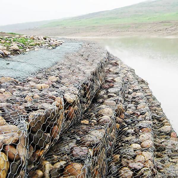Several galfan gabions are installed on the river bank