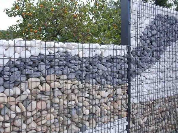 A gabion wall is installed in the park.