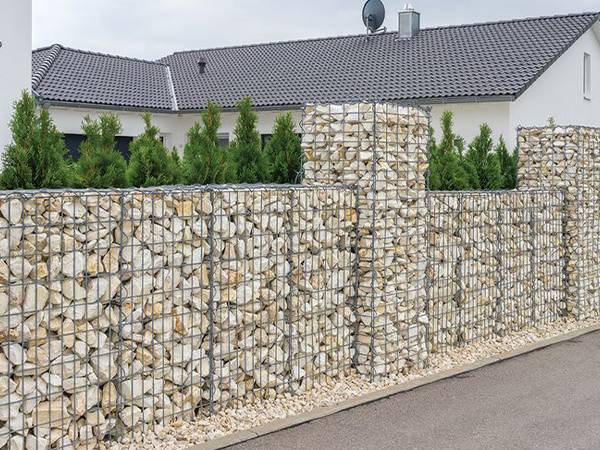A gabion wall is installed on the street.